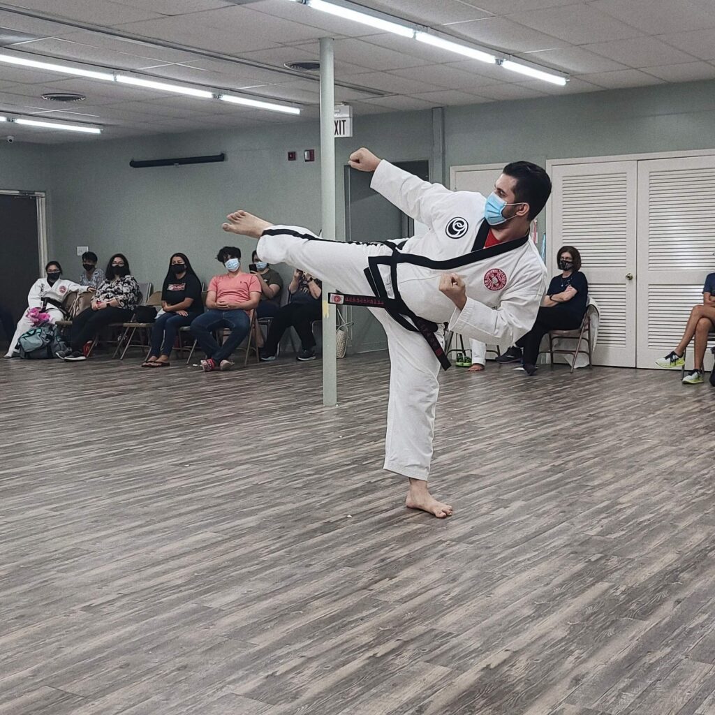 Sakubara Academy head instructor performing a side kick at his 5th Dan test.